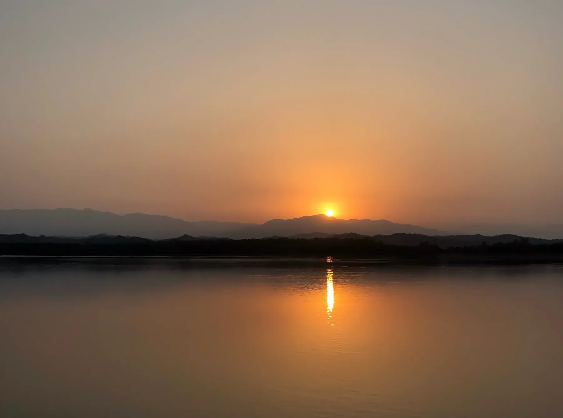 Sunrise over Sukhna Lake with the Shivalik hills behind